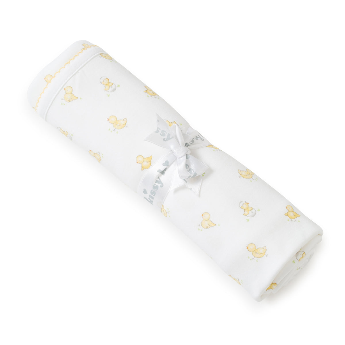 Rolled-up white baby blanket with yellow duck pattern on a white background.