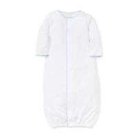 White gathered at bottom converter gown blue trim on a white background.