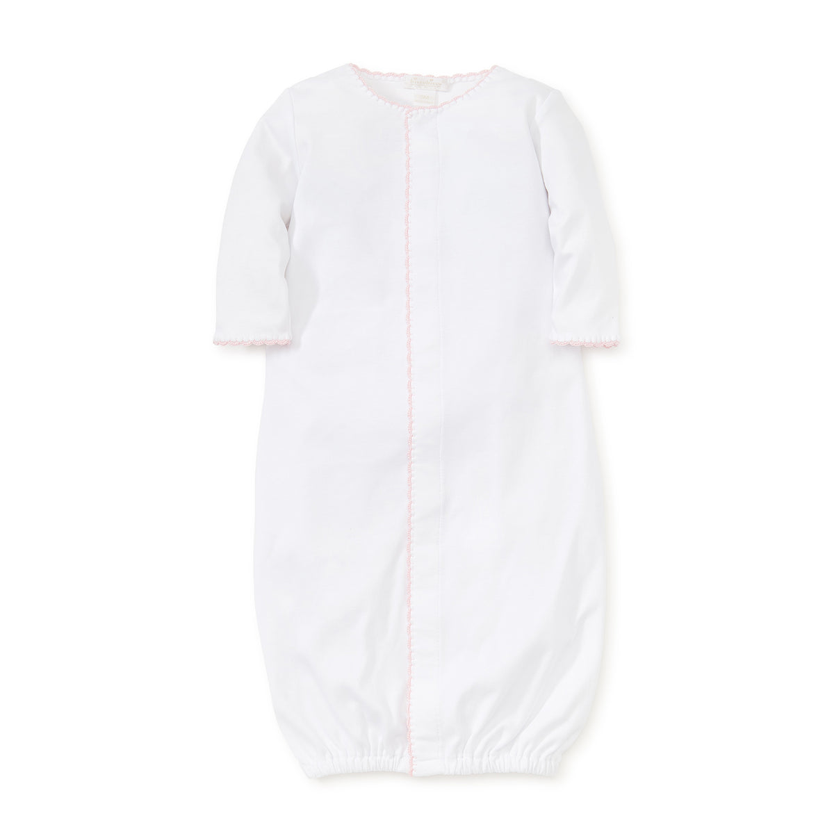 White gathered at bottom converter gown with pink trim on a white background.
