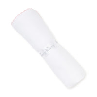 Rolled white baby blanket with pink embroidered border on a white background.