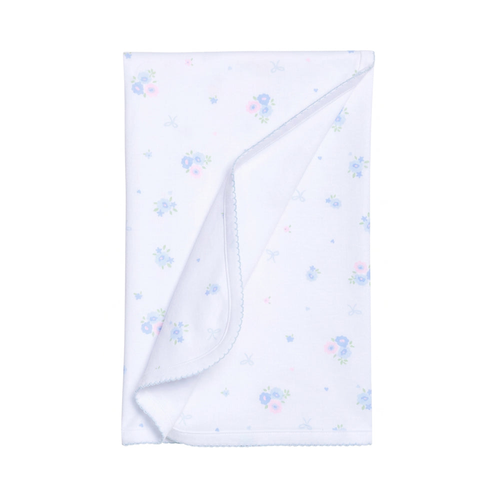 White baby blanket with blue floral patterns on a white background.