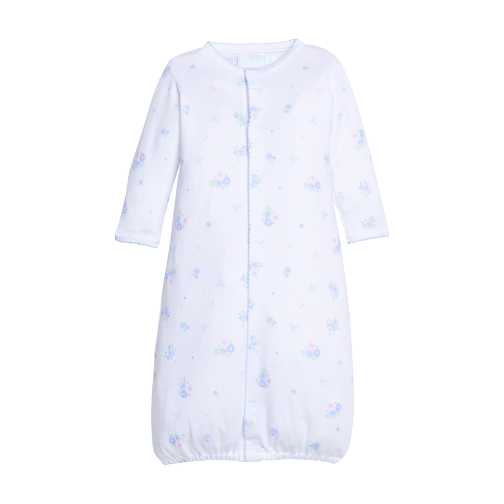 White baby converter gown with blue floral pattern on a white background.