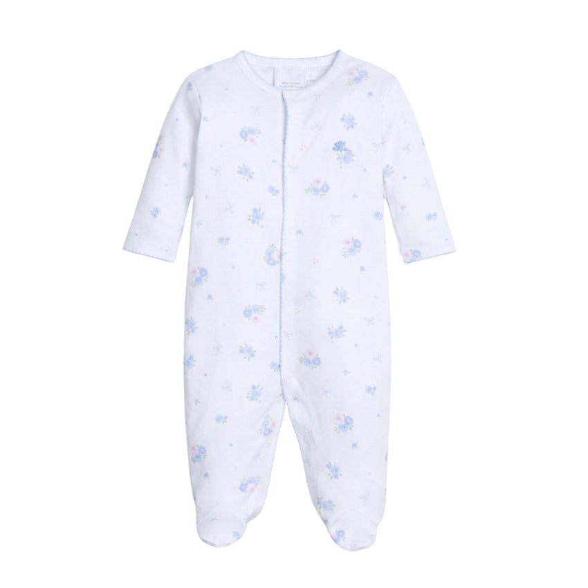 White baby footie with blue patterns on a white background.