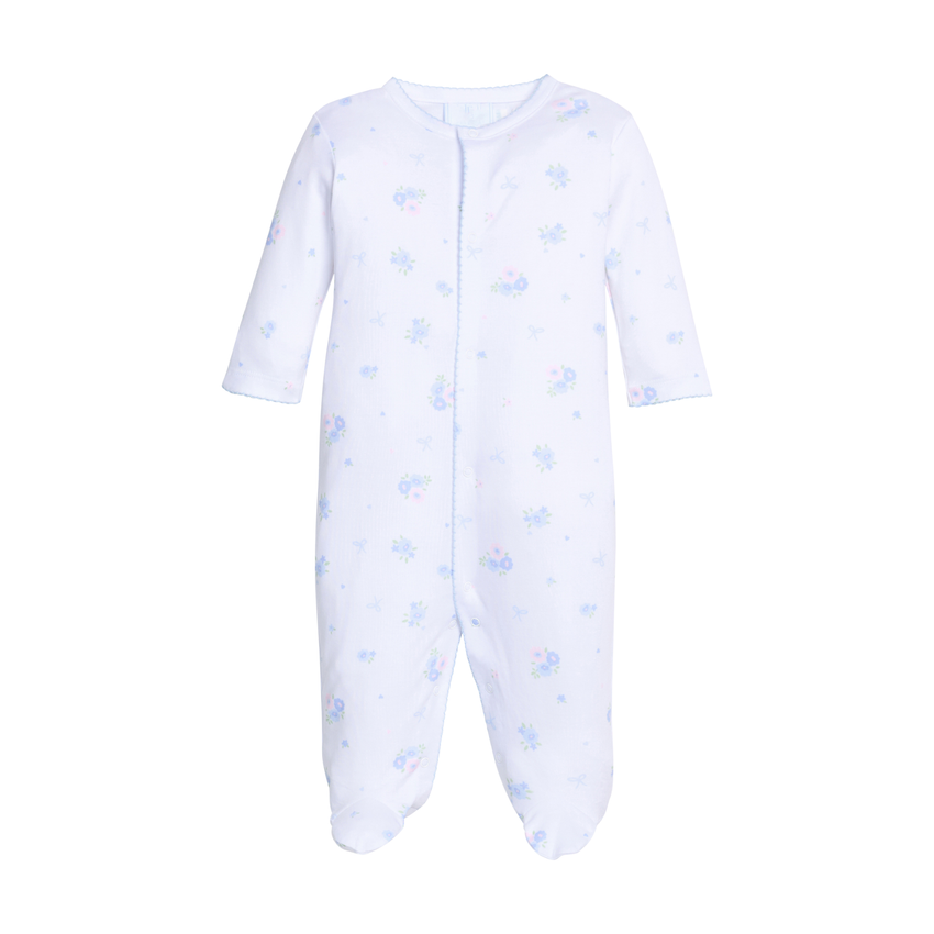 White baby footie with blue patterns on a white background.