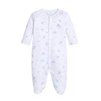 White baby footie with blue patterns on a white background.