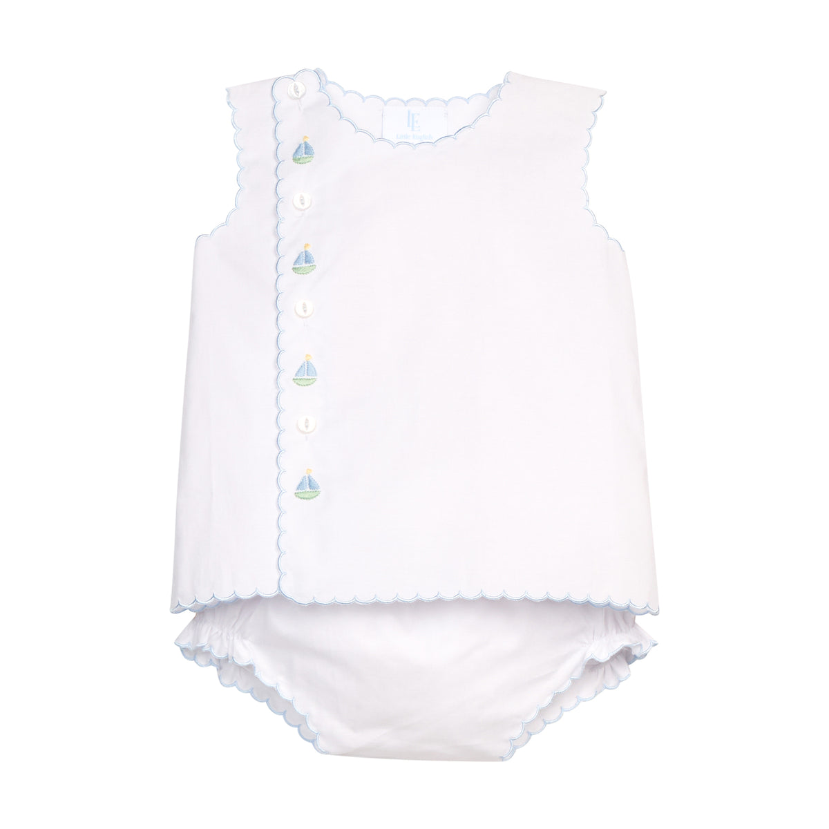 White two-piece baby outfit with off-center buttons and blue trim on a white background.