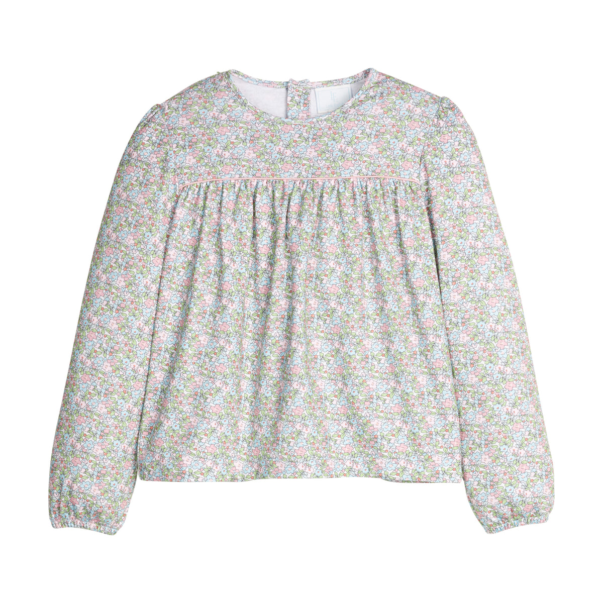 Green and pink floral blouse with long sleeves on a white background.