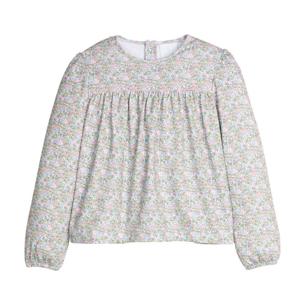 Green and pink floral blouse with long sleeves on a white background.