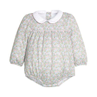 Green and pink floral baby romper with a white collar on a white background.