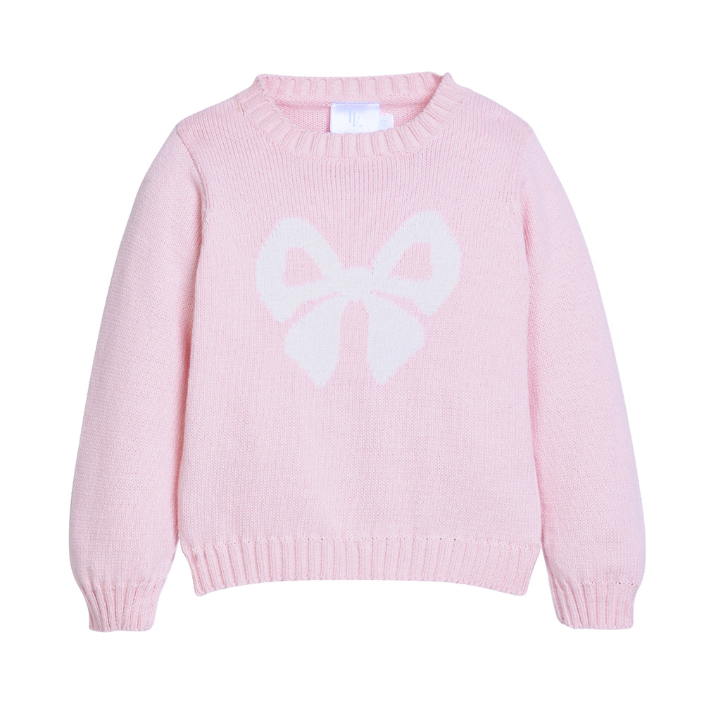Pink sweater with a large white bow on a white background.