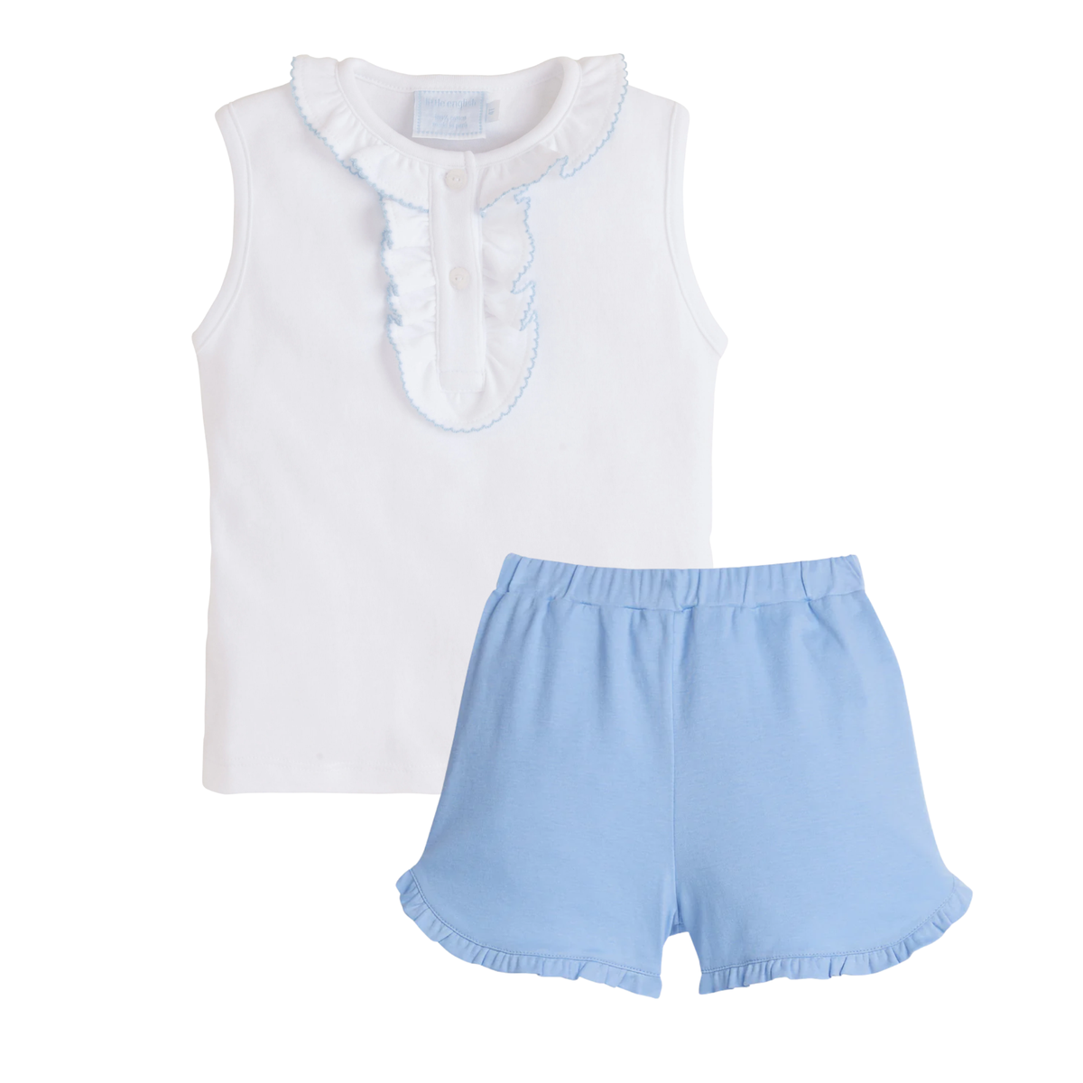 White sleeveless top with ruffled collar and light blue shorts on a white background.