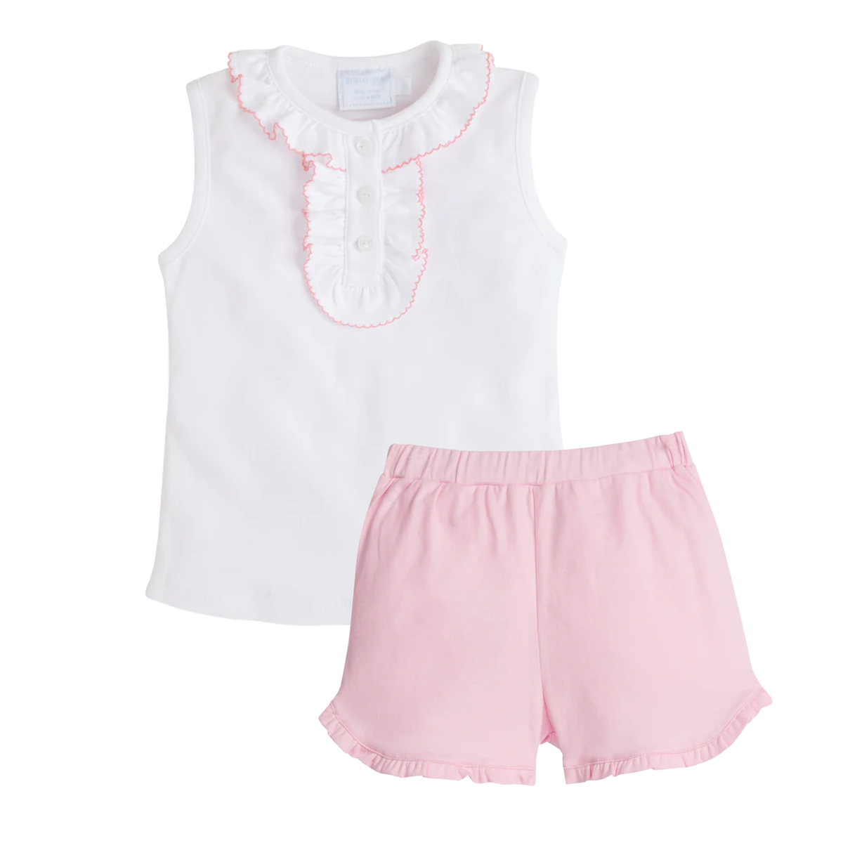 White sleeveless top with pink trimmed ruffled neckline and placket and pink shorts on a white background.