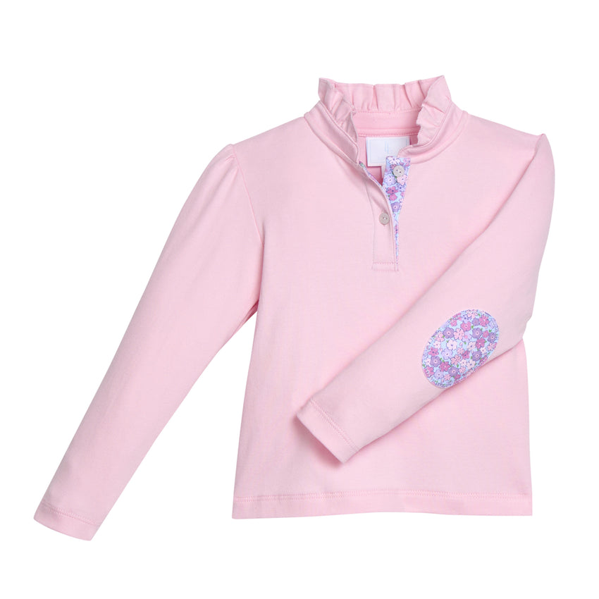 Pink pullover top with ruffled collar with floral elbow patches and placket on a white background.