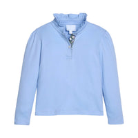 A light blue long-sleeve top with a ruffled mock neck, a short button placket, and a decorative floral pattern along the inner placket, shown on a plain white background.