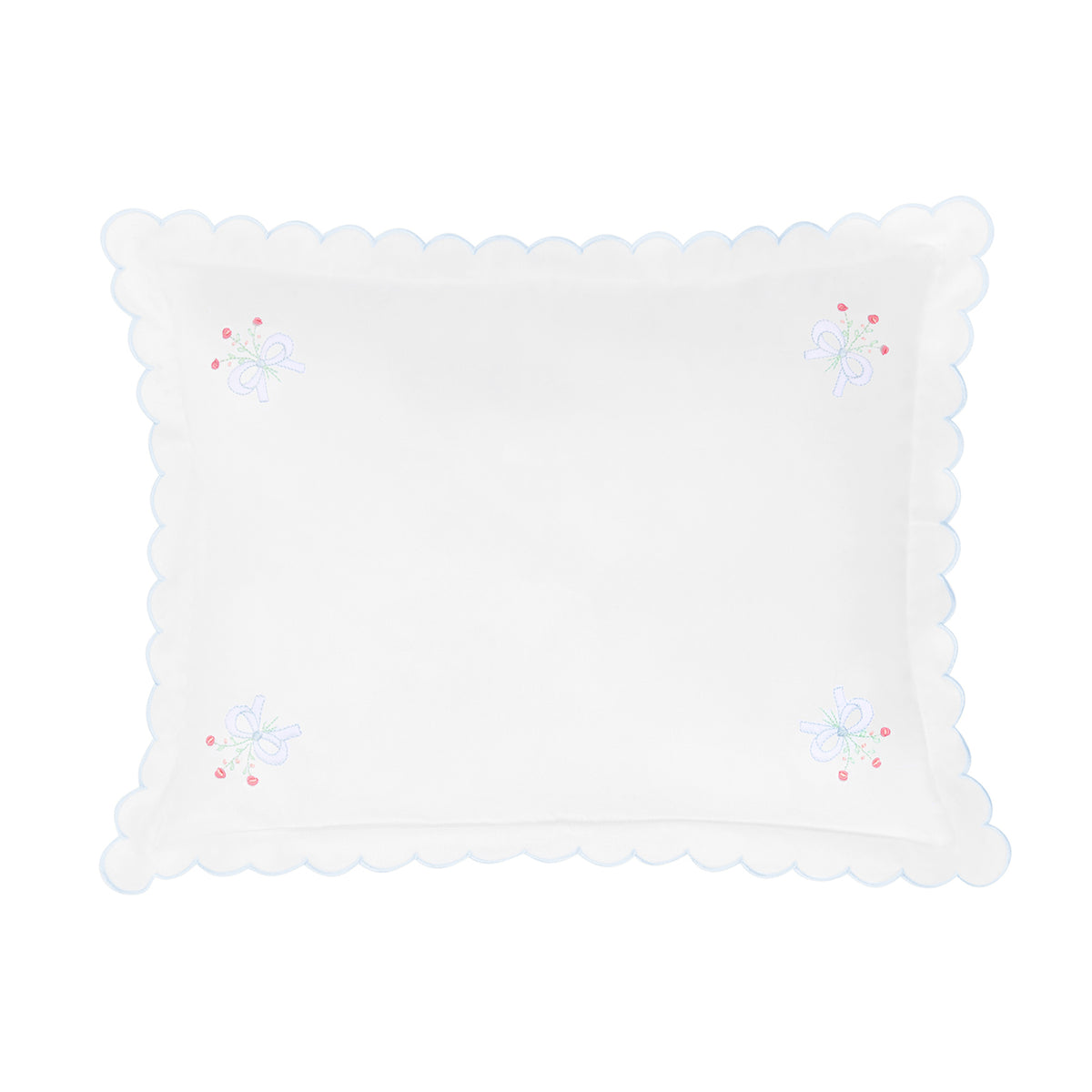White decorative pillow with scalloped edge and embroidered details on a white background.