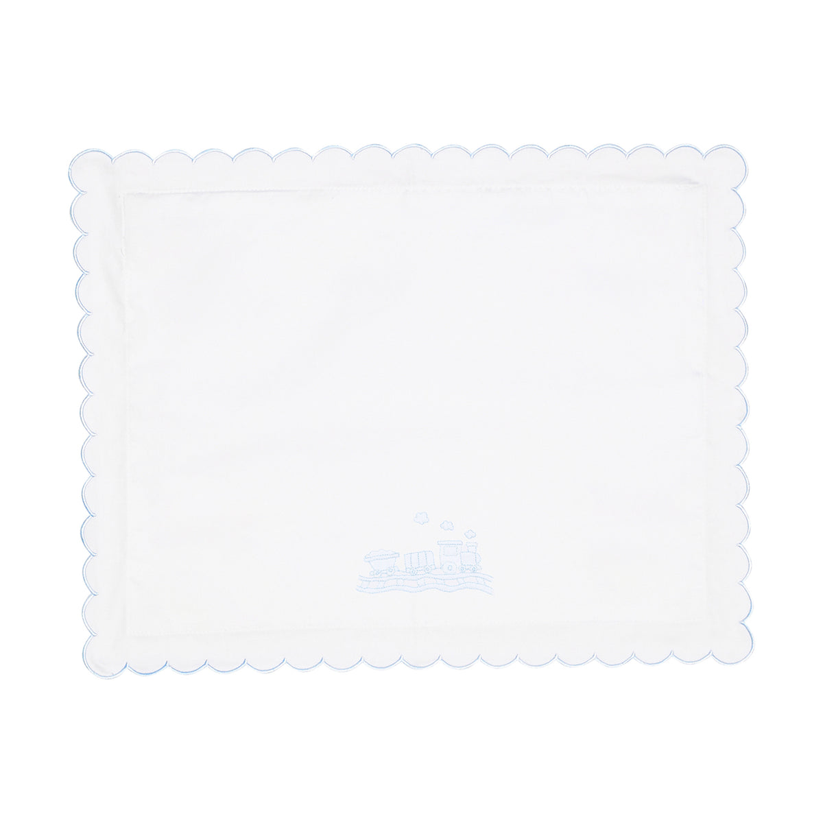 White scalloped pillow with train design shown on a white background.