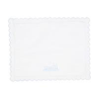 White scalloped pillow with train design shown on a white background.