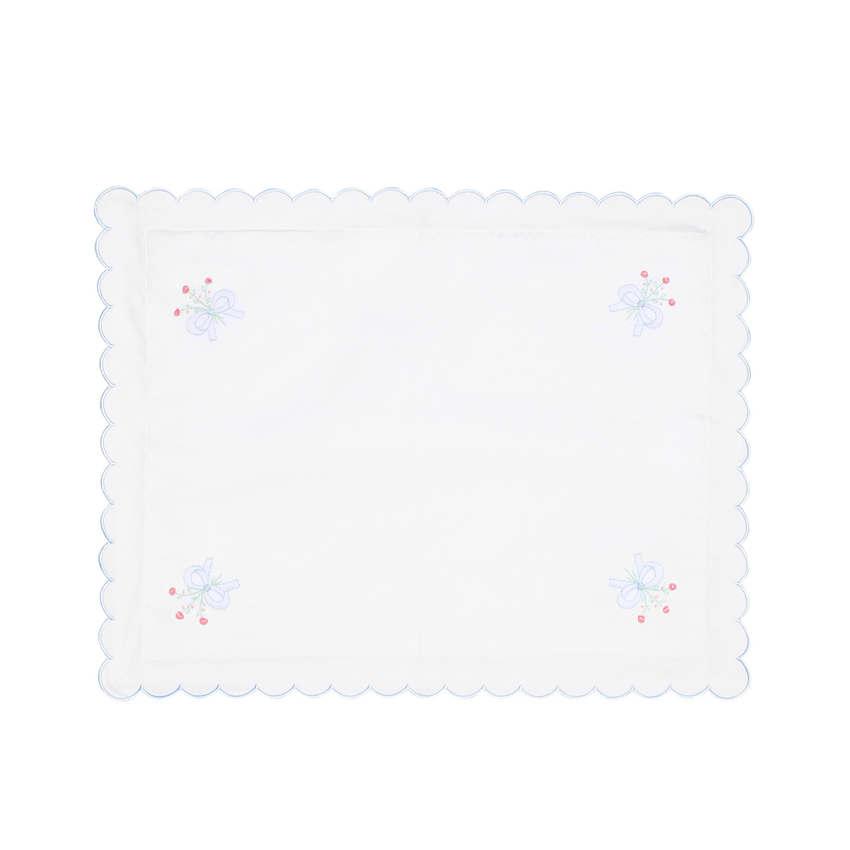 White pillow case with embroidered designs on a white background.