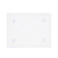 White pillow case with embroidered designs on a white background.