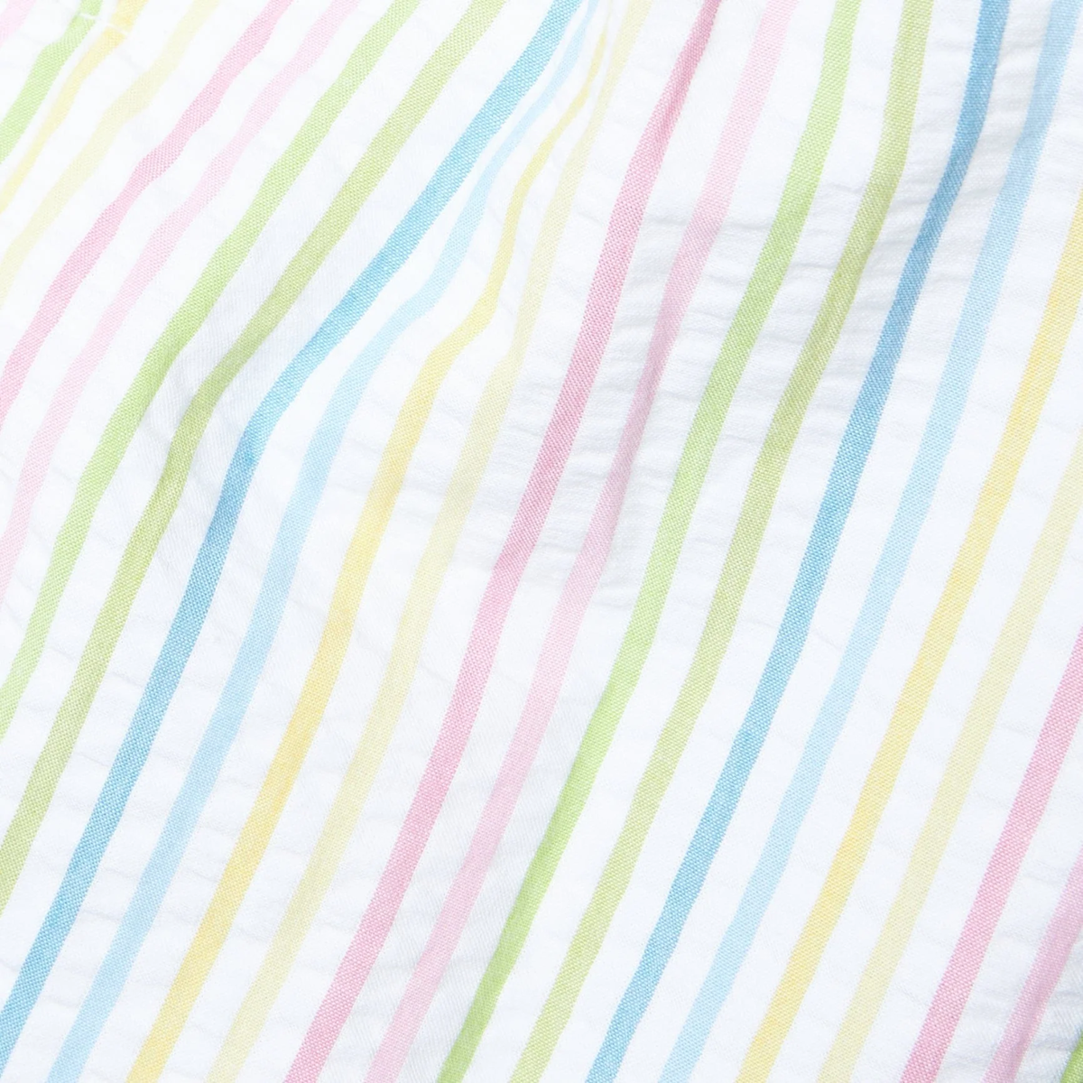 Pastel striped fabric pattern with pink, blue, green, and yellow lines on a white background.