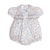 Blue themed floral  romper with puff sleeves and embroidery on a white background.
