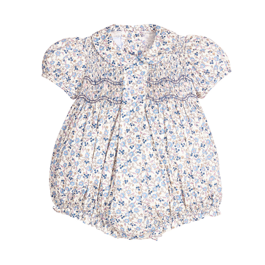 Blue themed floral  romper with puff sleeves and embroidery on a white background.