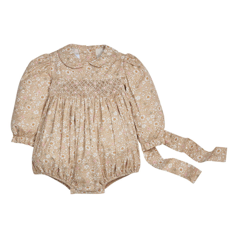 Beige floral baby romper with bow  on a white background