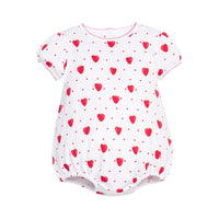 White baby romper with red strawberry patterns on a white background.