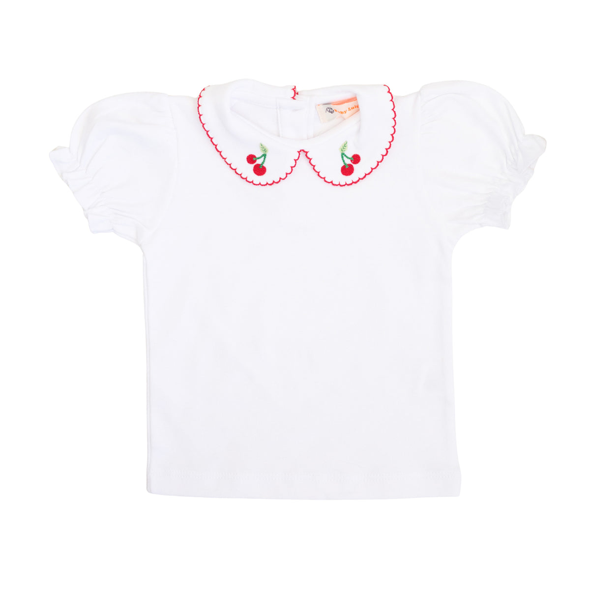 White blouse with cherry embroidery on a Peter Pan collar on a white background.