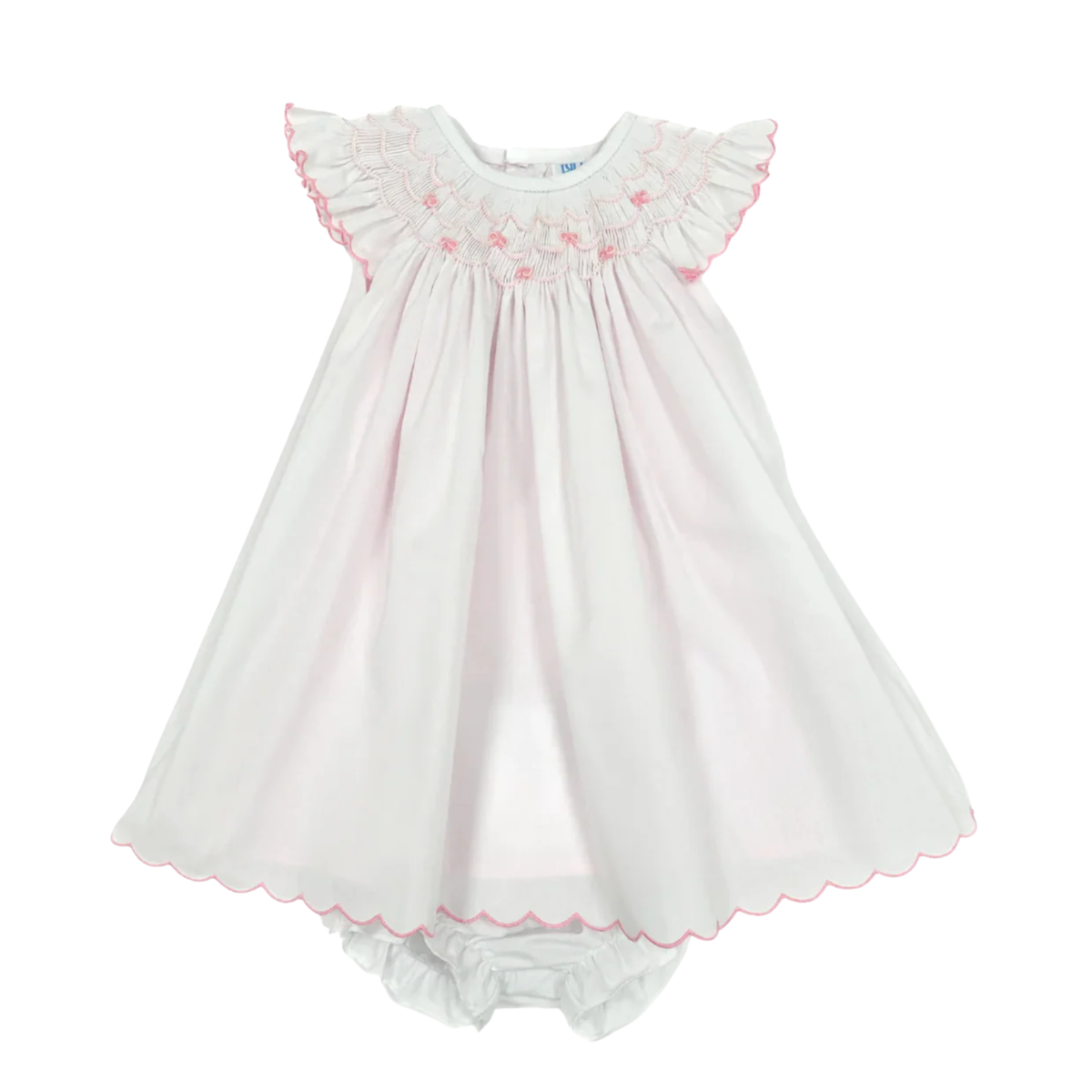 White baby dress with bishop collar, pink trim and hem scallops on a white background.
