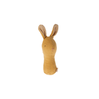 Yellow bunny rattle on a white background.