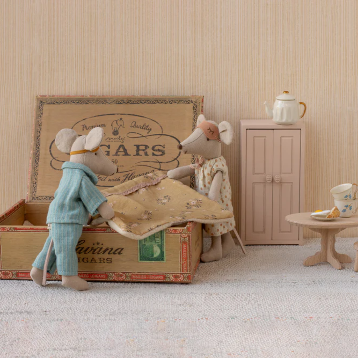 Mom and dad mouse making cigar box bed and other bedroom furniture.