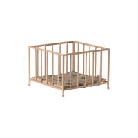 Beige metal playpen on a white background.