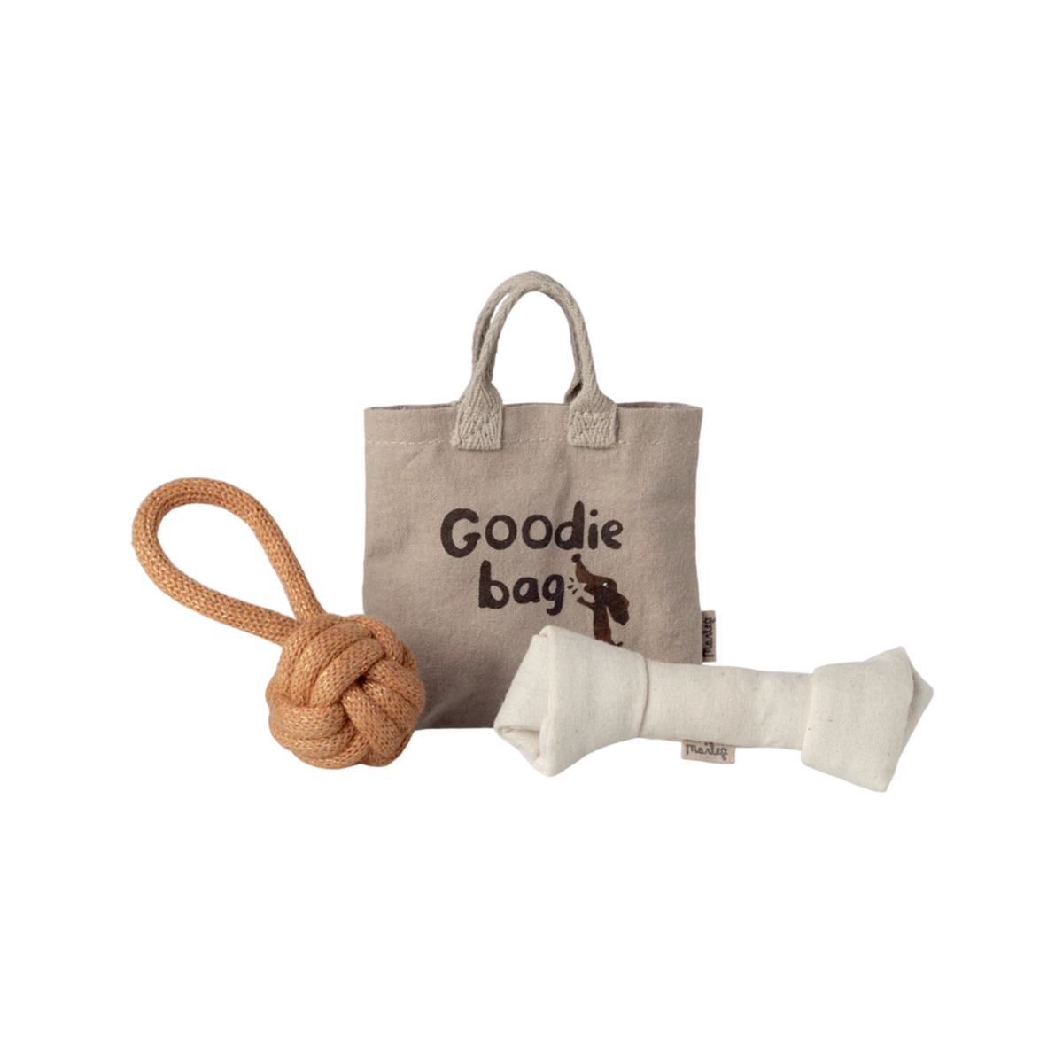 Small goodie bag with a rope toy and a bone-shaped chew toy on a white background