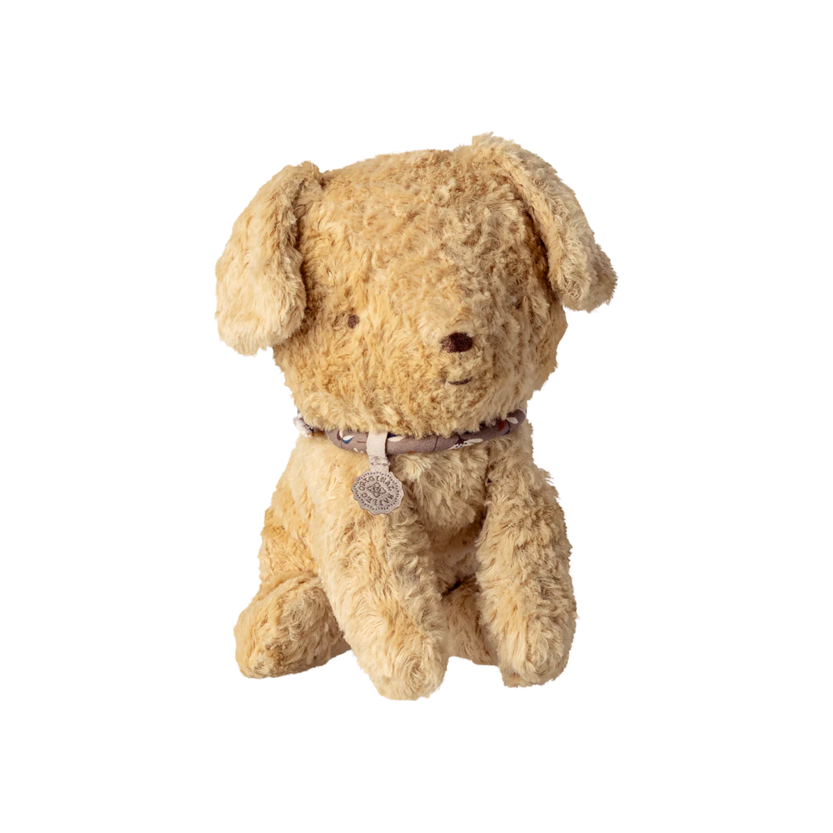 Stuffed dog toy with a collar on a white background.