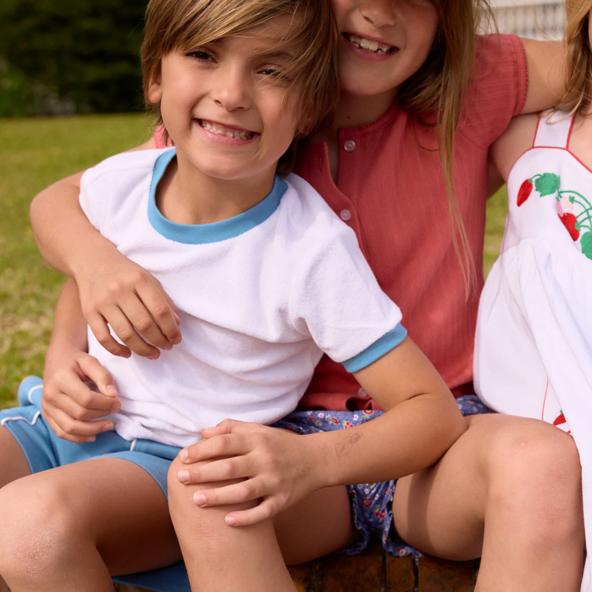 Models wearing colorful shorts and tops.