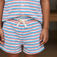 Person wearing a red, white, and blue striped outfit with shorts and a top.