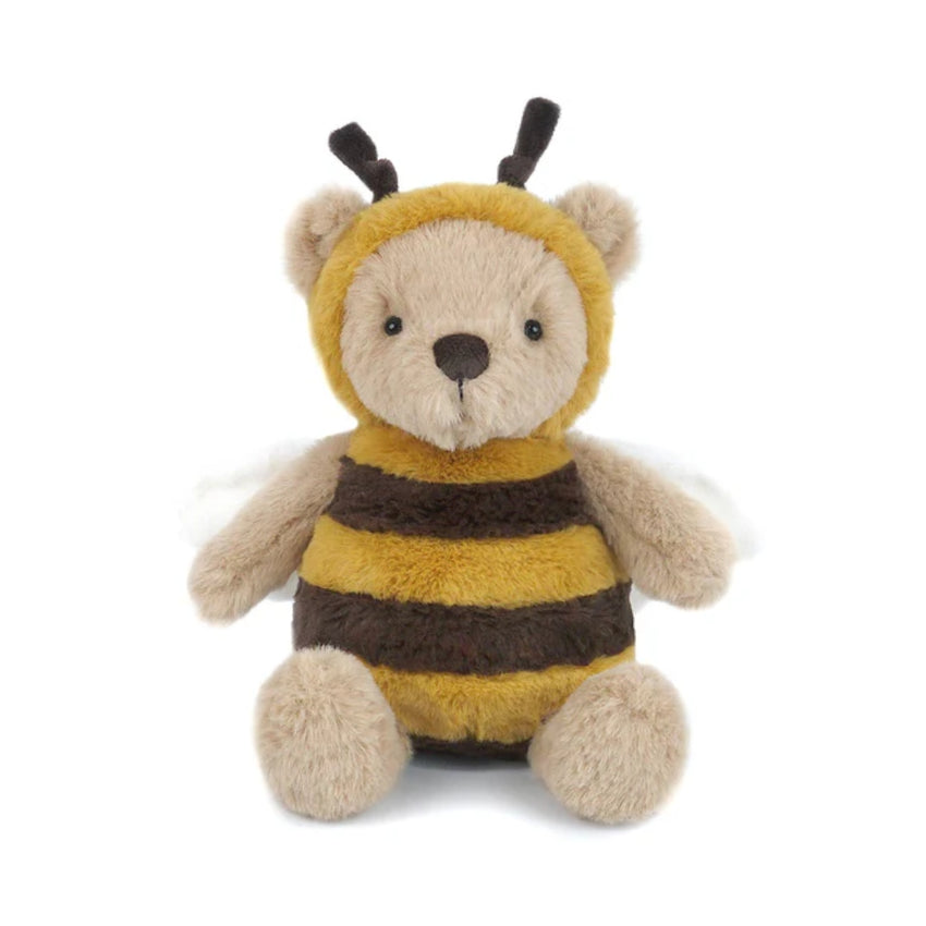 A plush teddy bear dressed as a bee, featuring a yellow and dark brown striped fuzzy body, a beige face and paws, and small black antennae, photographed on a plain white background.