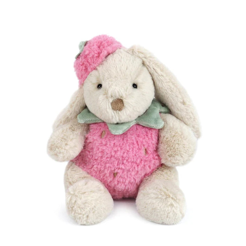 Plush toy rabbit in a pink strawberry  outfit and hat on a white background.