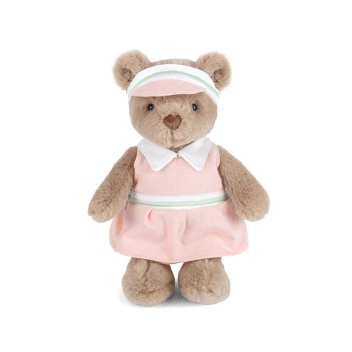 Teddy bear in a pink golf dress with a white collar and visor on a white background.