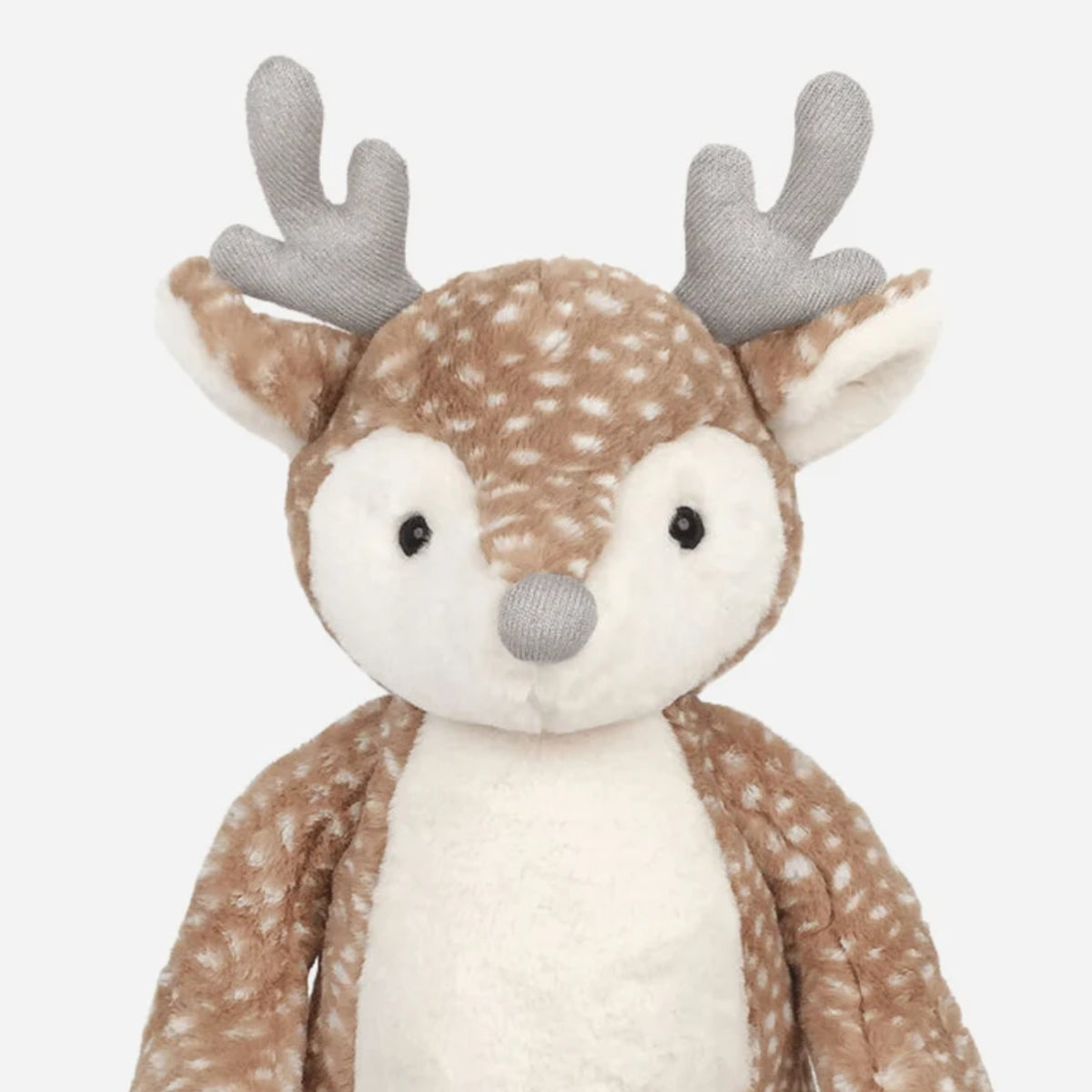 A plush stuffed deer toy with a brown and white spotted pattern, gray antlers, and a white snout, photographed against a plain light gray background.