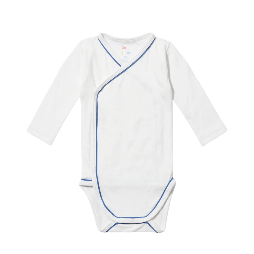 White crossbody one-piece with blue trim and  long sleeves on a white background.