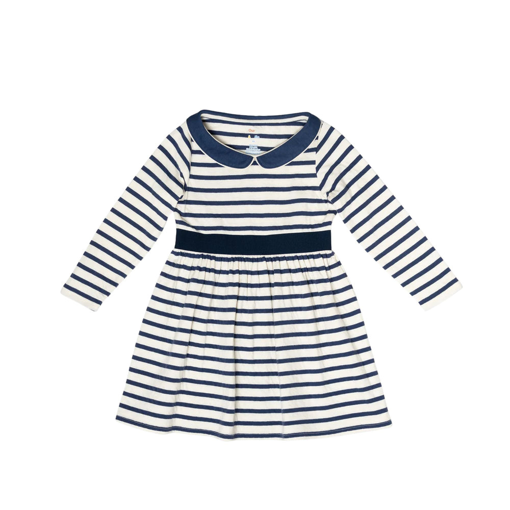 A long-sleeve baby dress with navy blue and white horizontal stripes, featuring a solid navy collar and waistband, displayed flat against a white background.
