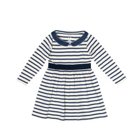 A long-sleeve baby dress with navy blue and white horizontal stripes, featuring a solid navy collar and waistband, displayed flat against a white background.