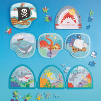 Set of children's magnetic puzzles with various themes on a blue background.