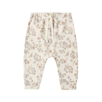 Floral-patterned baby drawstring pants on a white background.