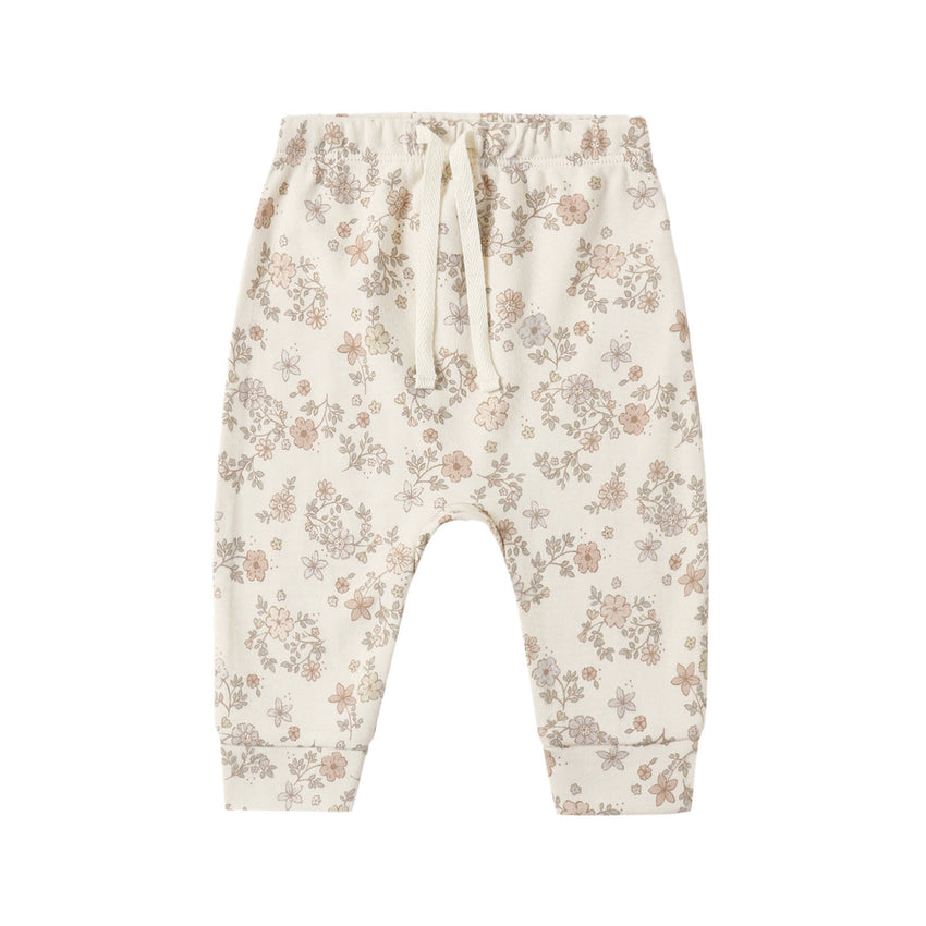 Floral-patterned baby drawstring pants on a white background.