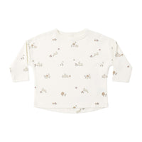 Baby long-sleeve shirt with small bunny print on a white background.
