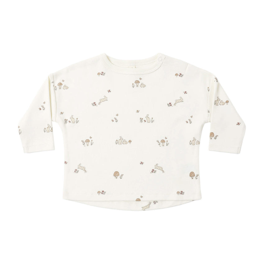 Baby long-sleeve shirt with small bunny print on a white background.