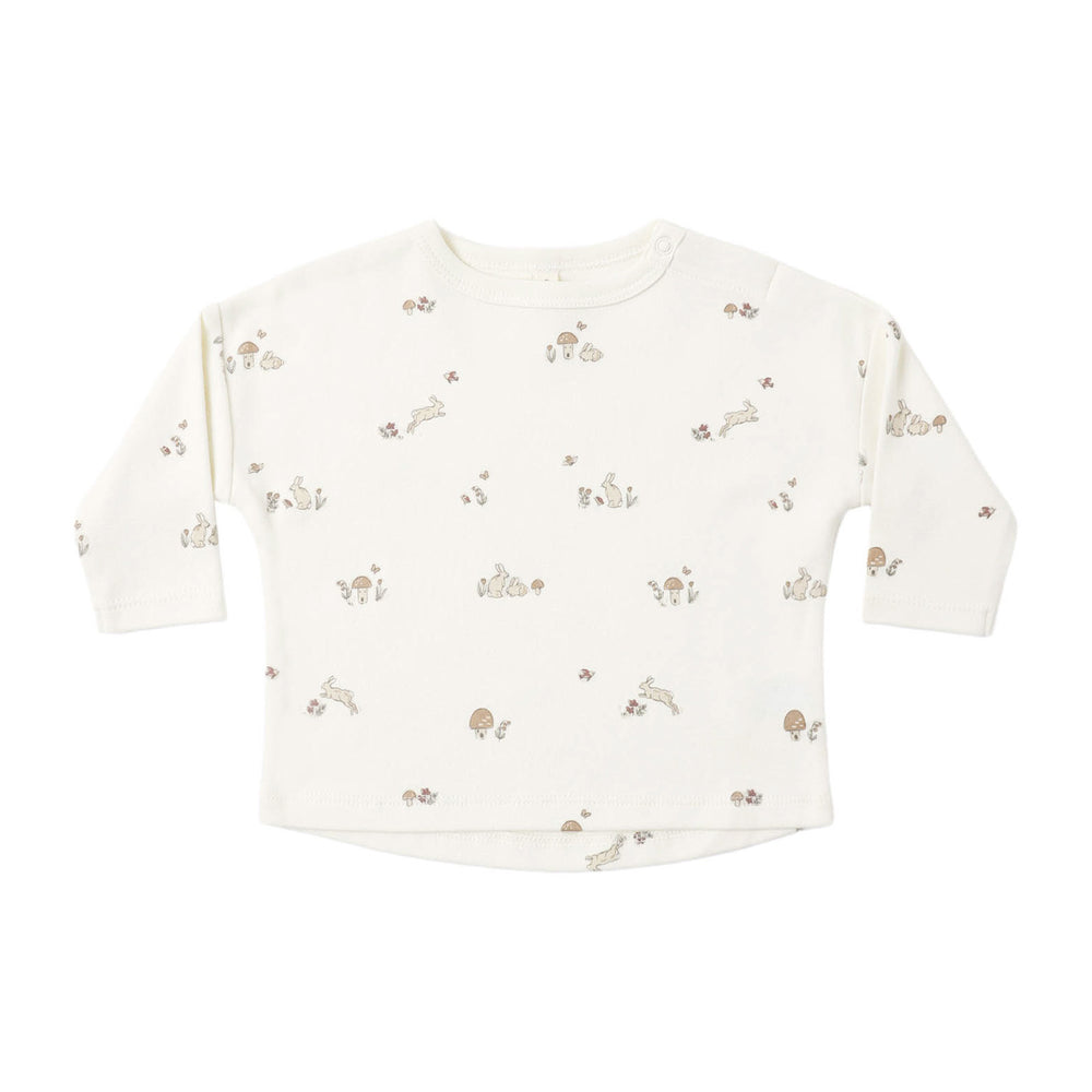 Baby long-sleeve shirt with small bunny print on a white background.
